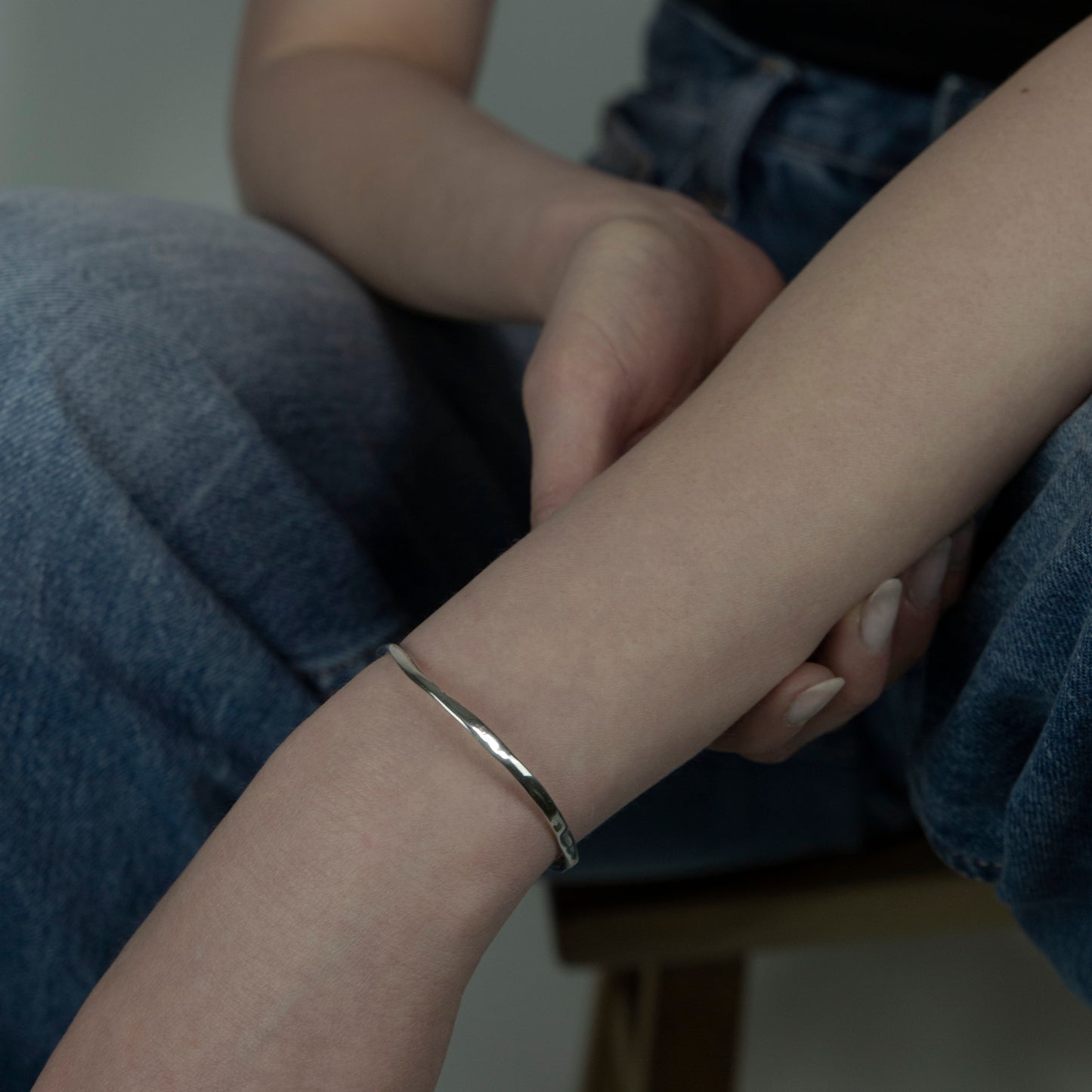 The Branch bracelet is a handmade creation crafted from sterling silver 925, featuring an exquisite and delicate minimal design. It gently fits low on the wrist, providing a smooth and glossy sensation.