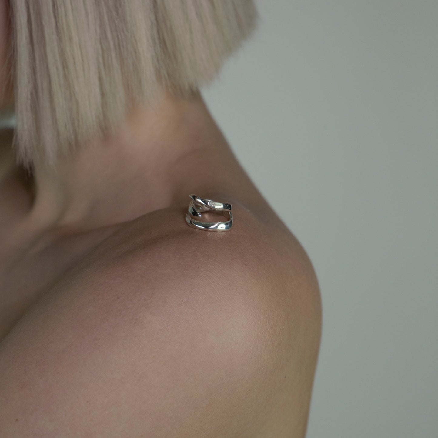 The Spinus ring is a handcrafted piece made of 925 sterling silver. It is composed of three silver bands and is smooth and glossy