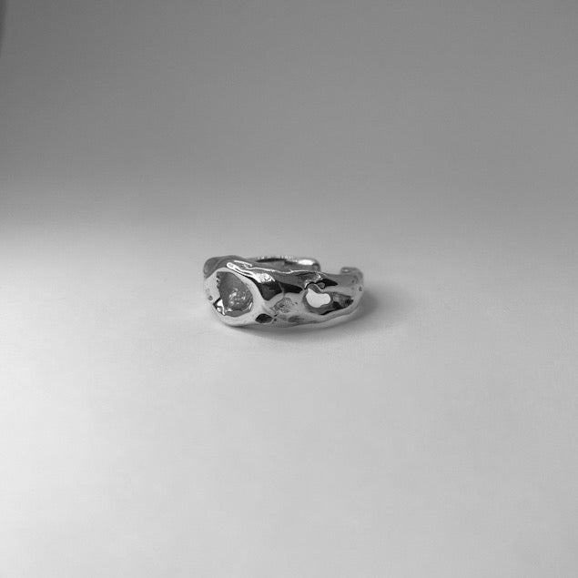 The Wild ring is a handmade piece made of 925 sterling silver. Its surface is raw and glossy