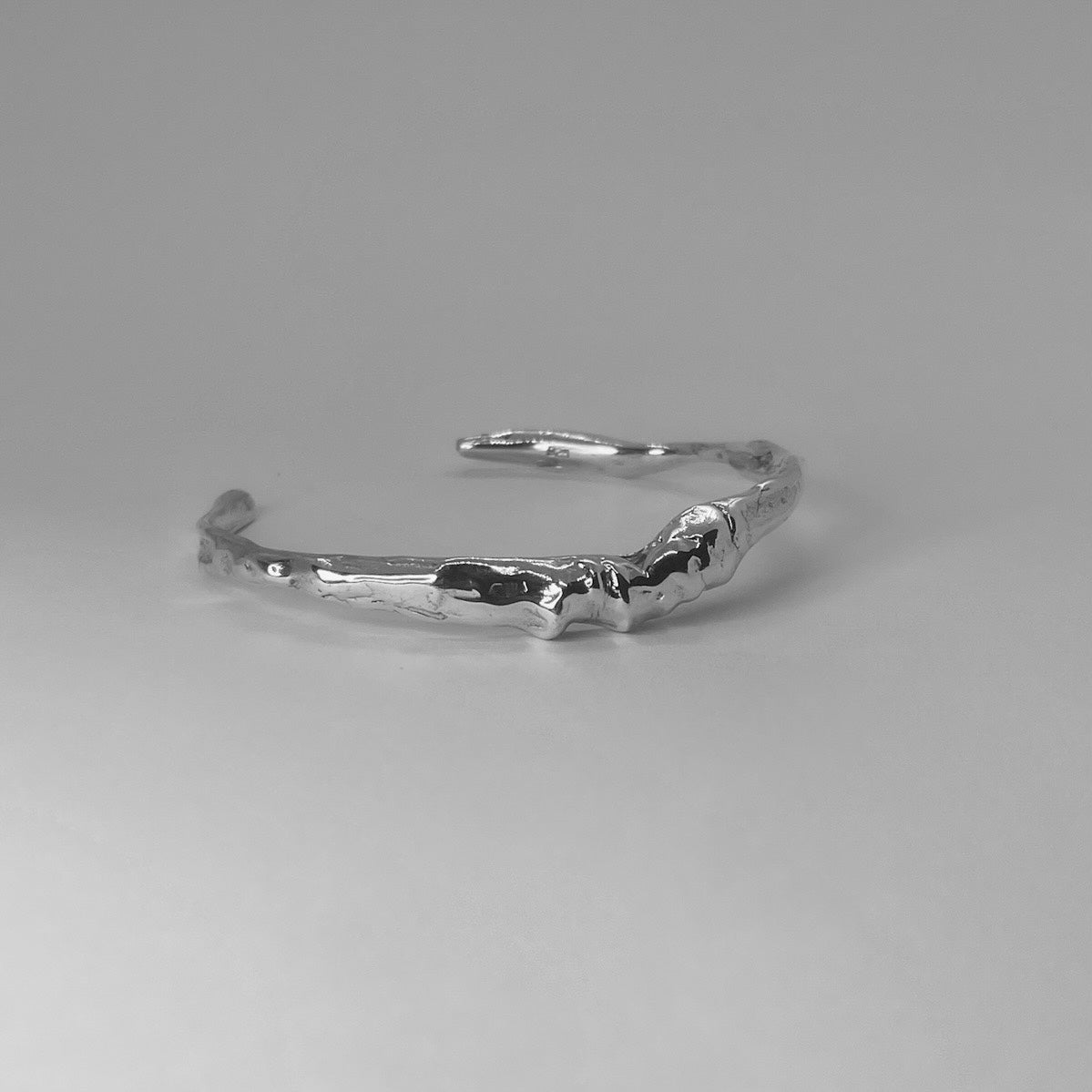 Handcrafted minimalistic bracelet with a raw texture, made from sterling silver 925