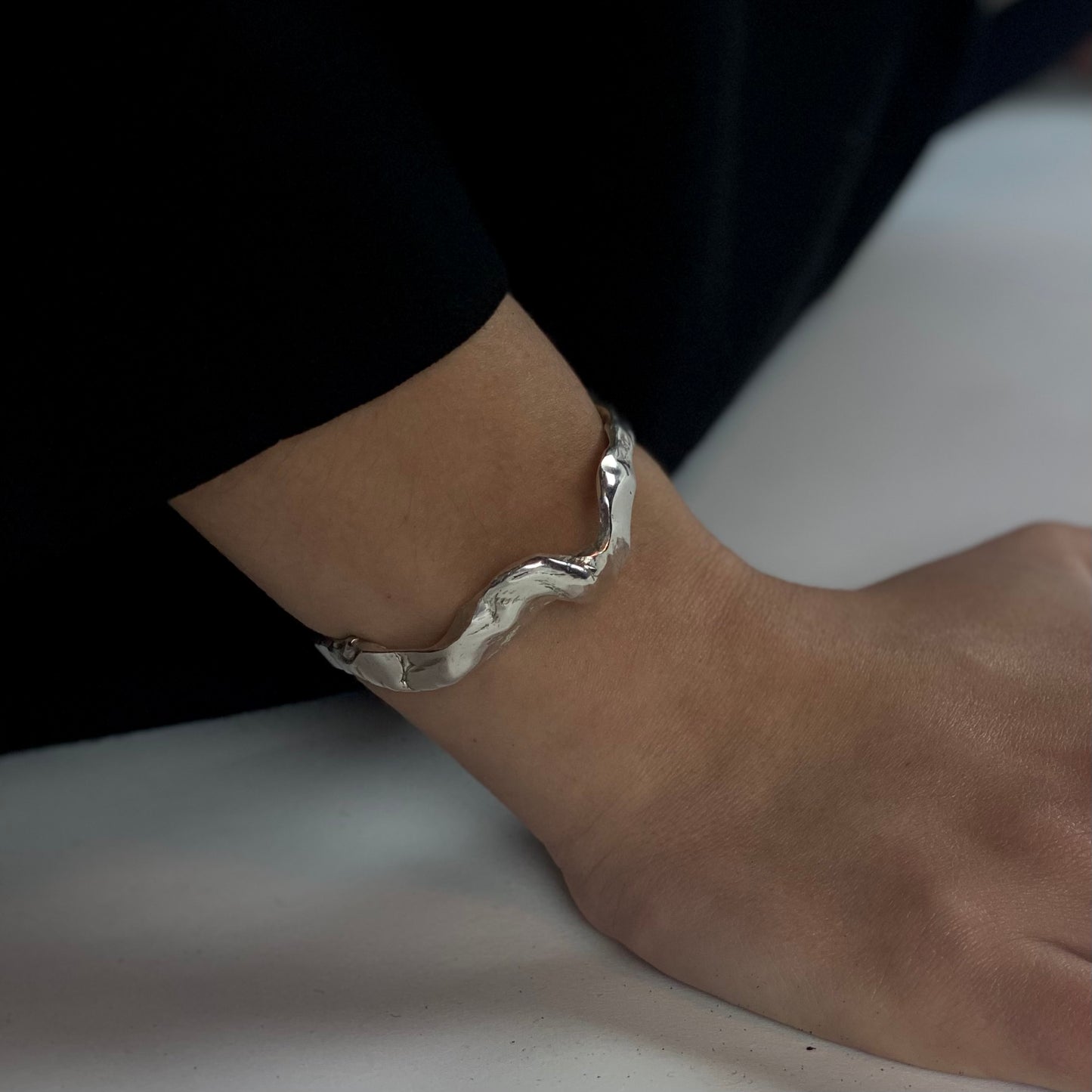 Handmade wavy bracelet with a raw form, crafted from sterling silver 925.