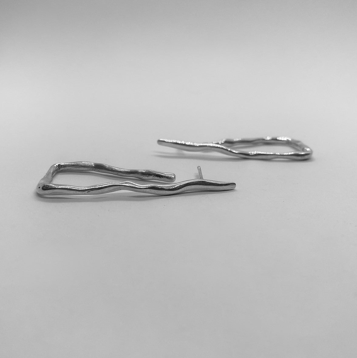 Handmade triangular earrings crafted from sterling silver 925.