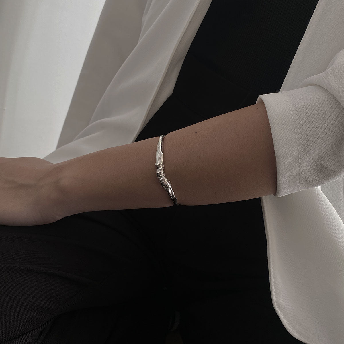 Handcrafted minimalistic bracelet with a raw texture, made from sterling silver 925