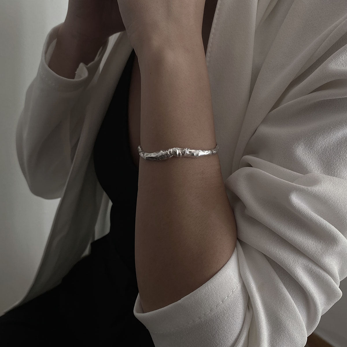 Handcrafted minimalistic bracelet with a raw texture, made from sterling silver 925