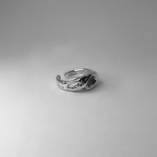 The Wild ring is a handmade piece made of 925 sterling silver. Its surface is raw and glossy