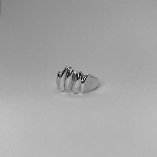 The Parv ring is a handmade piece made of 925 sterling silver. It consists of three vertical bands of silver with smooth and glossy finishes