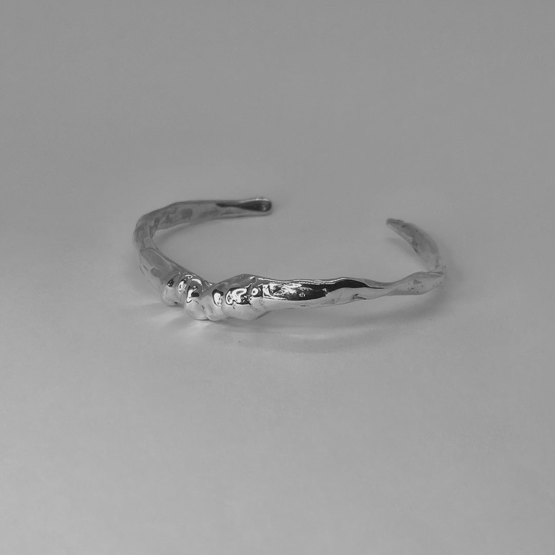 Handcrafted minimalistic bracelet with a raw texture, made from sterling silver 925
