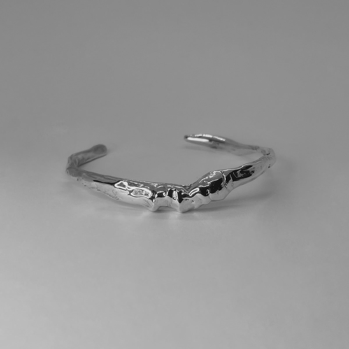 Handcrafted minimalistic bracelet with a raw texture, made from sterling silver 925