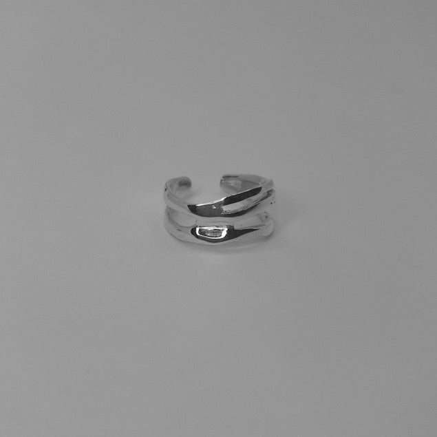 The Darli ring is a handcrafted piece made of 925 sterling silver. It is smooth and glossy, and it has various openings on its surface.The ring is open and adjustable, allowing for resizing up to three sizes. Therefore, it’s important to know your ring size.