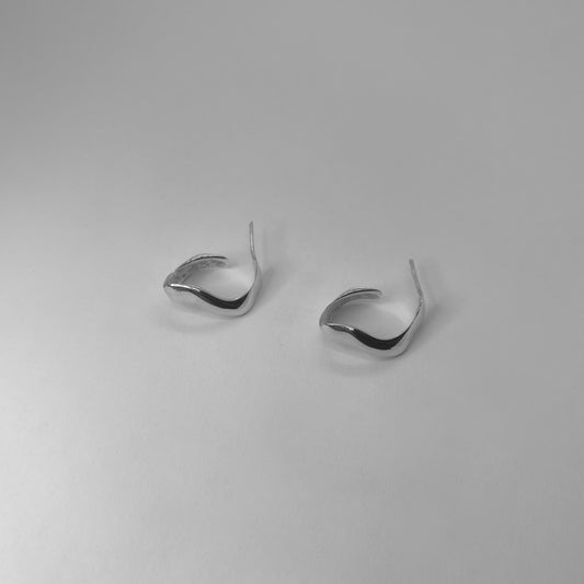 Handmade wavy oval-shaped hoops crafted from sterling silver 925