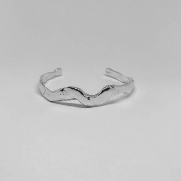 Handmade wavy bracelet with a raw form, crafted from sterling silver 925.