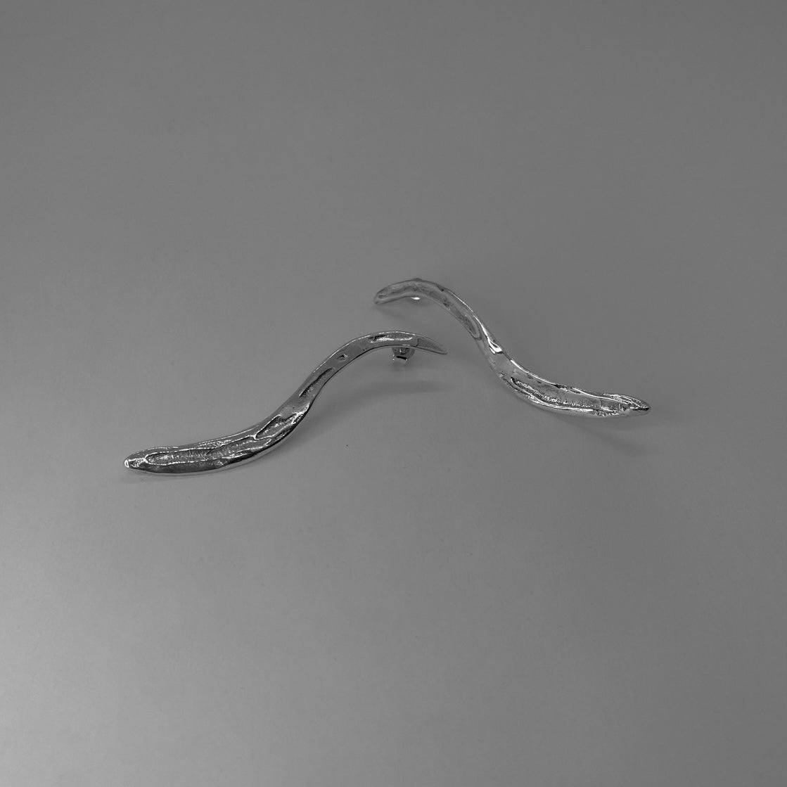 Long, wavy, carved earrings, handmade and crafted from sterling silver 925