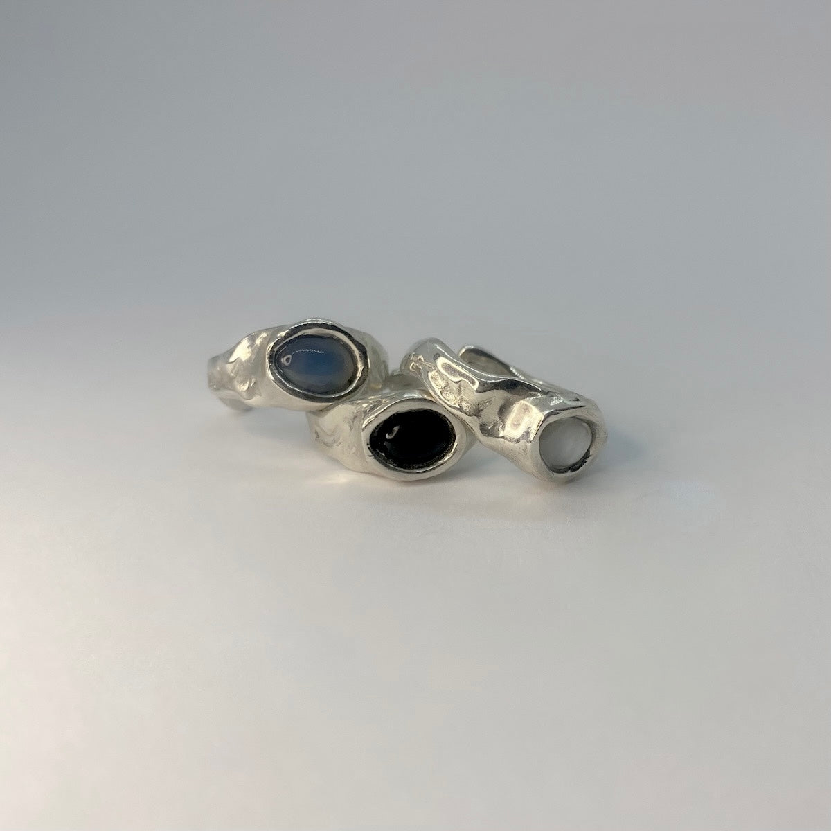 Semi-precious Gemstones: Black Agate, Chalcedony, Green Agate, or Mother of Pearl
Size &amp; Fit: Available in sizes 43mm to 60mm. Features an open, adjustable design that can be resized up to 3 sizes for a custom, perfect fit.
Finish: Smooth, polished finish with an organic, raw aesthetic
Craftsmanship: 100% Handcrafted in Greece
