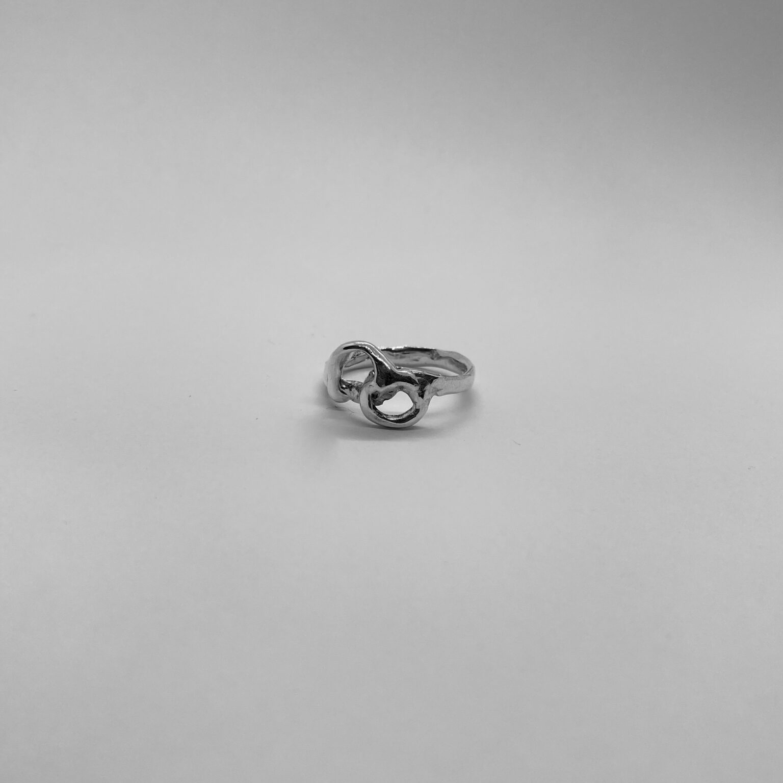 The Twin ring is a handmade piece made of 925 sterling silver. Its surface is smooth and glossy.
