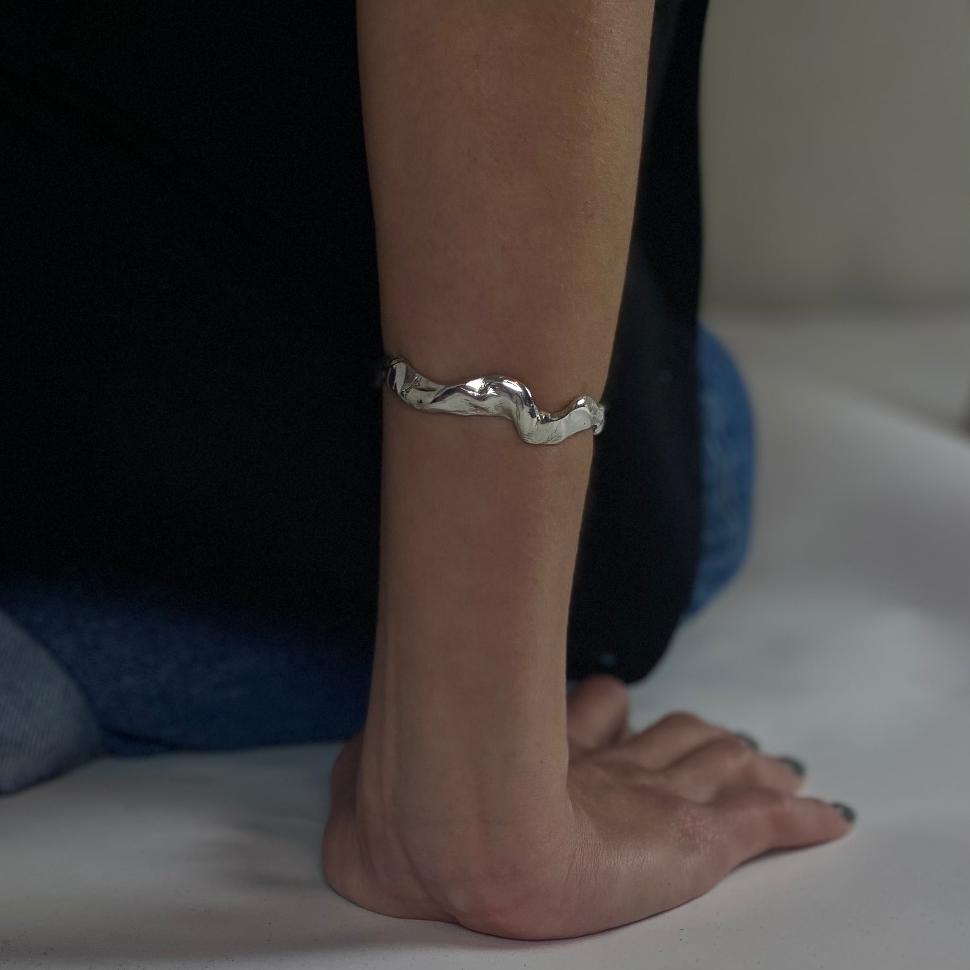 Handmade wavy bracelet with a raw form, crafted from sterling silver 925.