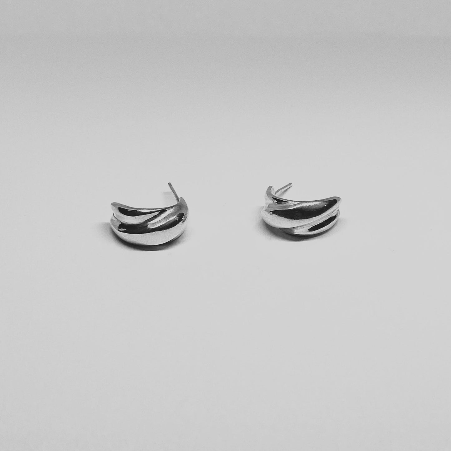 The Malan earrings are handmade and made of 925 sterling silver. They are shiny and polished