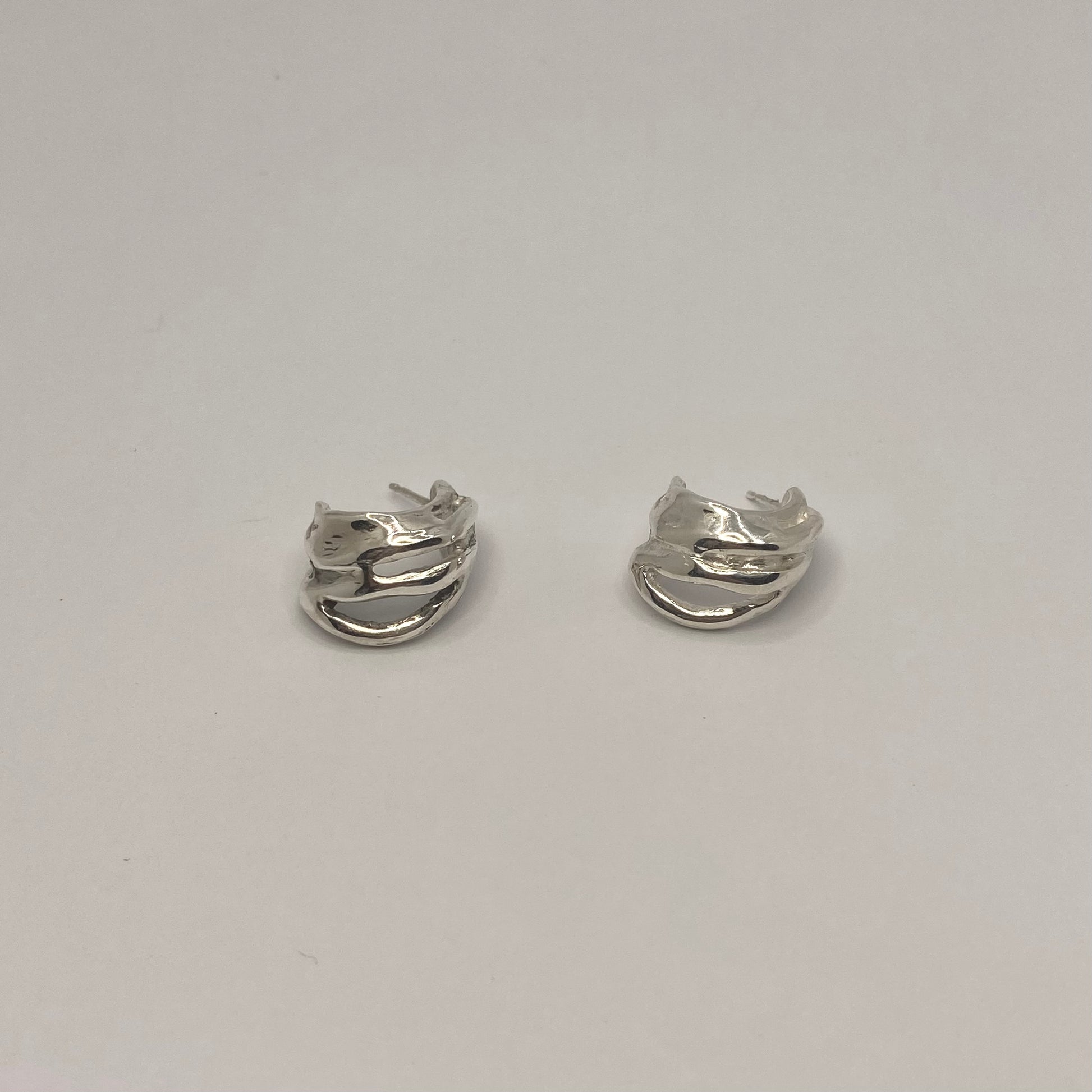 Handcrafted 925 Sterling Silver Groove Hoops

Material: 925 Sterling Silver
Design: Chunky hoop earrings featuring distinct grooved lines and elegant cut-out details.
Size &amp; Fit: Designed for a bold yet comfortable look. Perfect for everyday wear or statement styling.
Quantity: Sold as a pair.
Finish: Smooth, polished finish with an organic, raw aesthetic
Craftsmanship: 100% Handcrafted in Greece
Production: Made to order
Shipping: Ships within 5–10 business days

Each piece of jewelry is individually h
