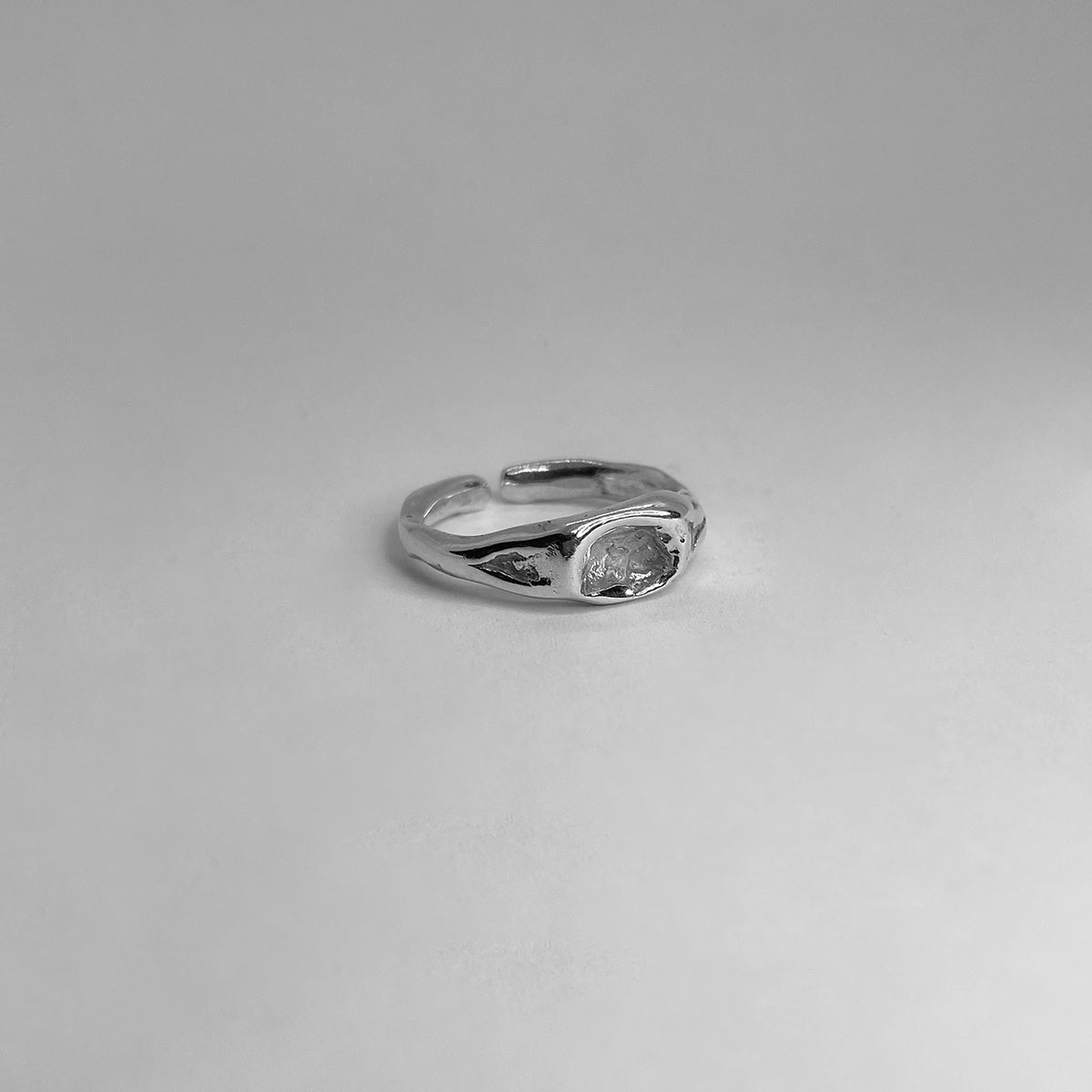 The Lize ring is a handmade piece made of 925 sterling silver. Its surface is raw and glossy