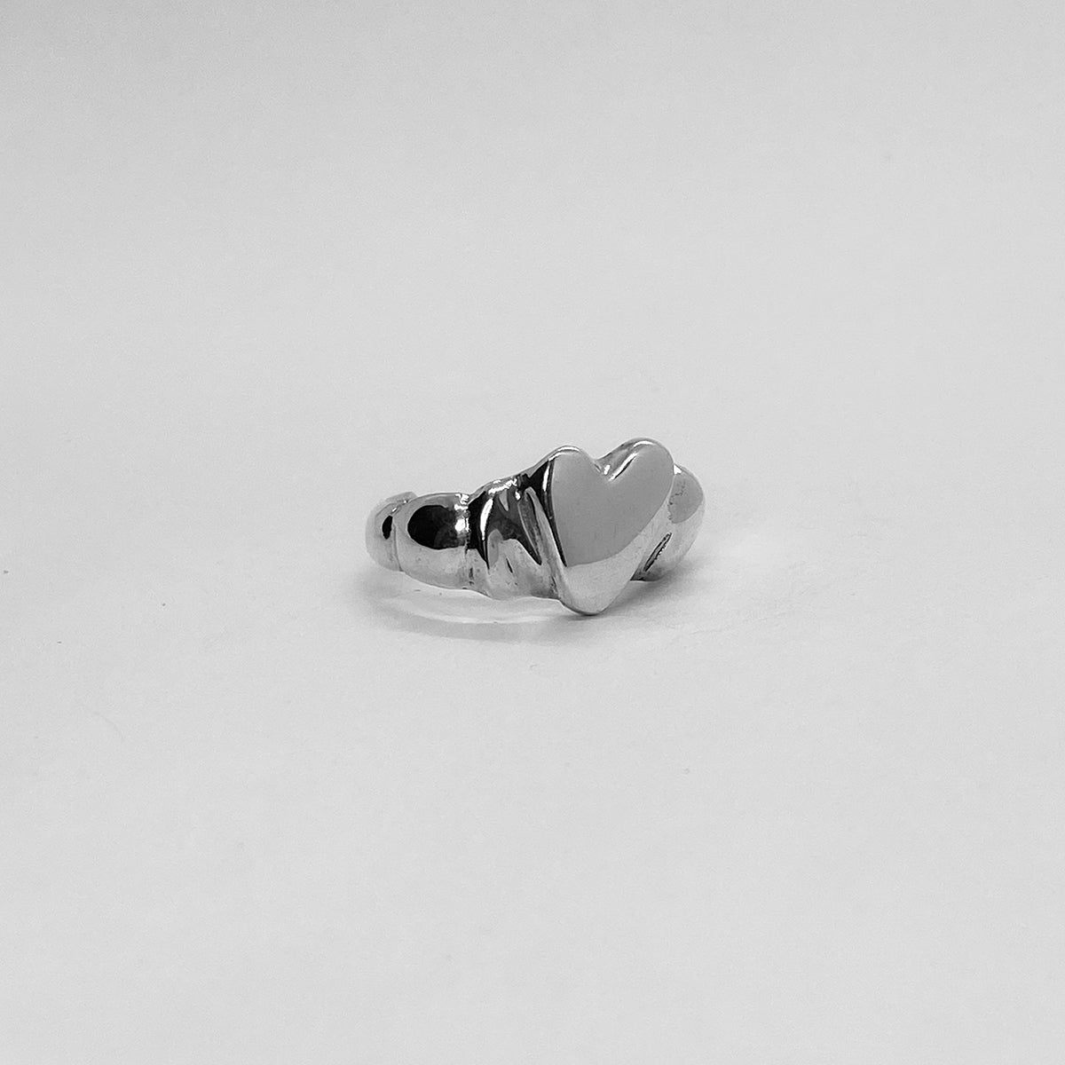 The Heart ring is a handmade piece made of 925 sterling silver. Its surface is glossy